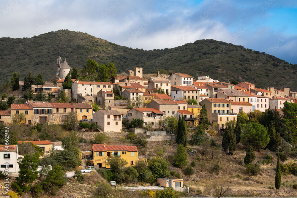 Picturesque view of Cucugnan commune with main landmark 17th-century windmill, Aude department, southern France