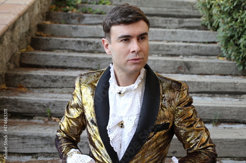 Gentleman showing opulence with golden outfit