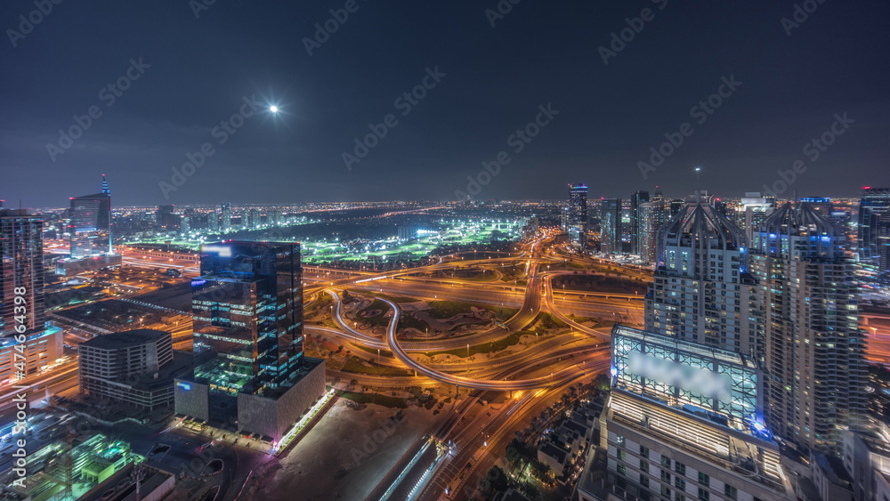 Fototapeta premium Huge highway crossroad junction between JLT district and Dubai Marina night timelapse.