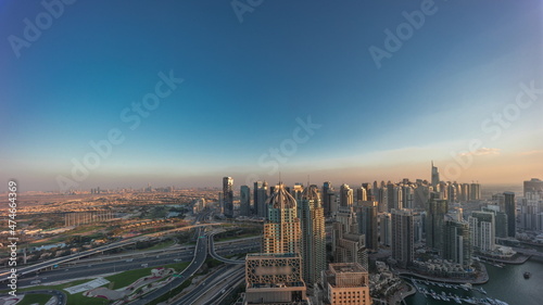 Dubai marina and JLT skyscrapers along Sheikh Zayed Road aerial day to night timelapse. © neiezhmakov