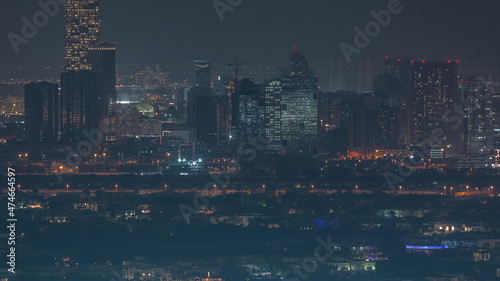 Aerial view of Jumeirah Village Circle district night timelapse