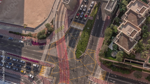 Aerial view of a road intersection between skyscrapers between skyscrapers timelapse.