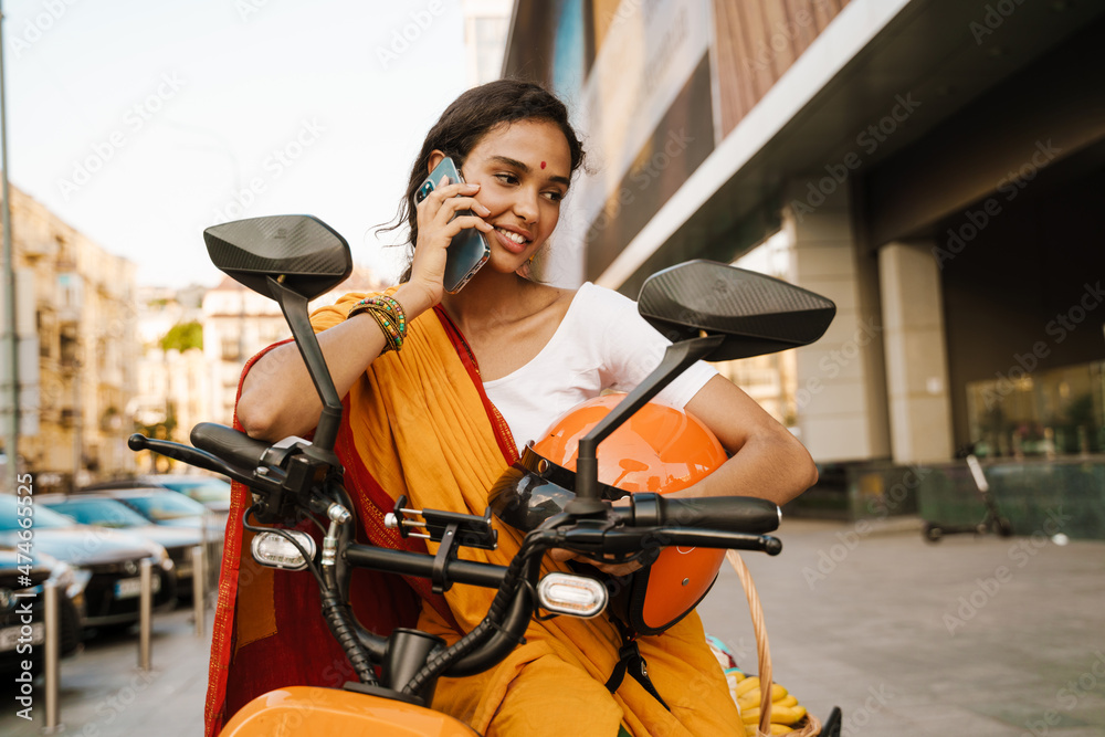Smiling young indian woman in traditional clothes Stock Photo | Adobe Stock