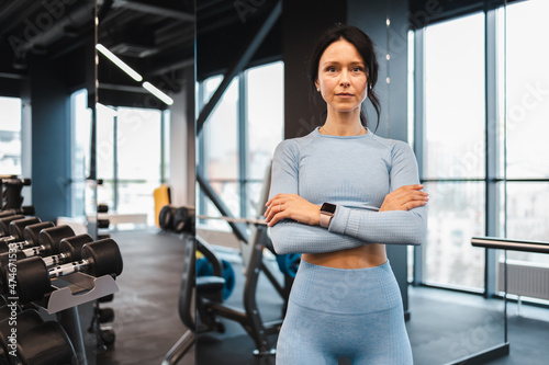 Portrait of female fitness trainer in the gym © Andrii 