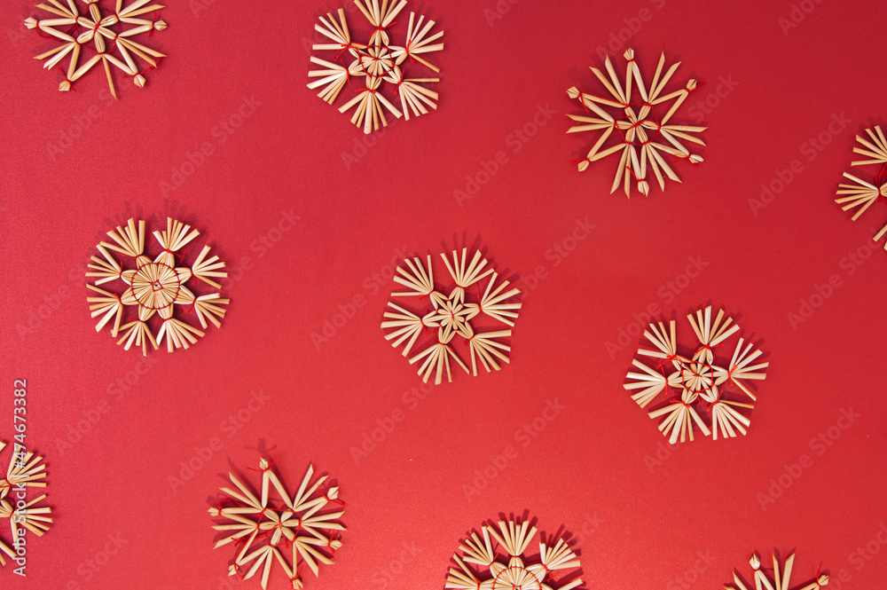 New Year goldy snowflake decoration on a bold red background. Flat lay Christmas pattern. New Year goldy snowflake decoration on a bold red background. Flat lay Christmas pattern.