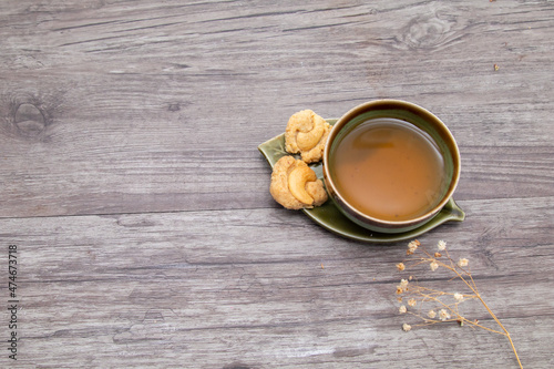 Tea and cookie on wooden vintage background, Top view of a Cup of Tea with Cookies, copy space.