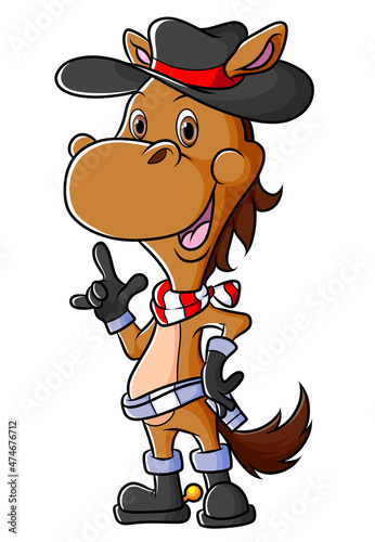 The cowboy horse is standing and wearing cap