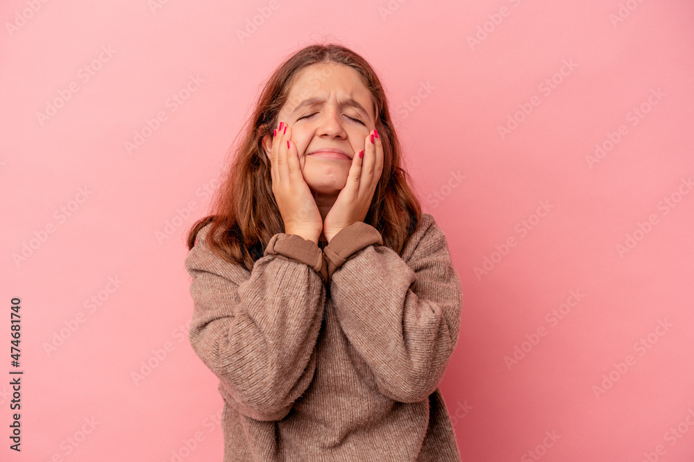 Little caucasian girl isolated on pink background crying, unhappy with something, agony and confusion concept. Little caucasian girl isolated on pink background crying, unhappy with something, agony and confusion concept.