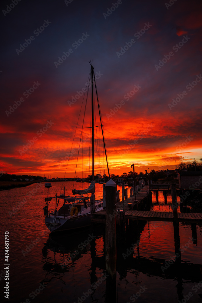 Fire over the Canal
We had an amazing sunrise in Lewes, Delaware.  I had to run out of the house and go shoot the canal, with the beautiful sunrise colors, with a sail boat/yacht in the foreground