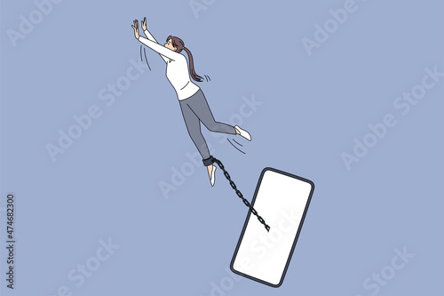 Addiction to internet and gadgets concept. Young woman trying to fly away from smartphone connected with chain on leg like slave vector illustration 