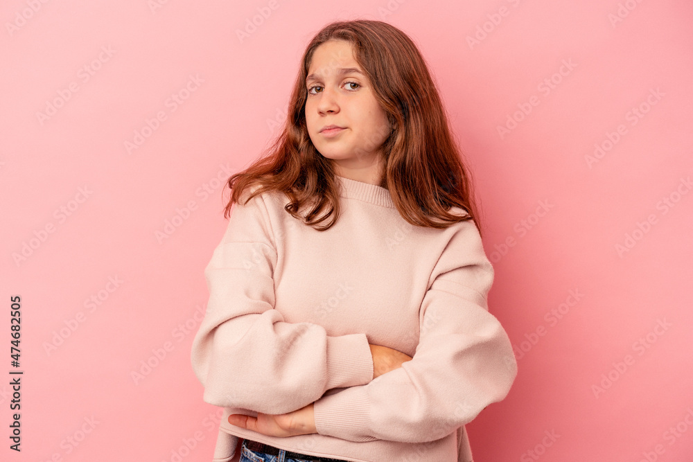 Obraz premium Little caucasian girl isolated on pink background unhappy looking in camera with sarcastic expression.