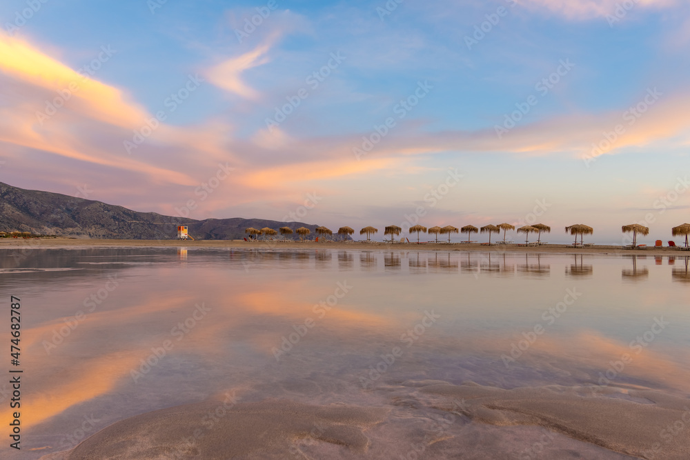 Fototapeta premium Stunning sunrise over the shallow waters of the Elafonisi lagoon (deer island) on the southwest tip of Crete, Chania region, Greece.