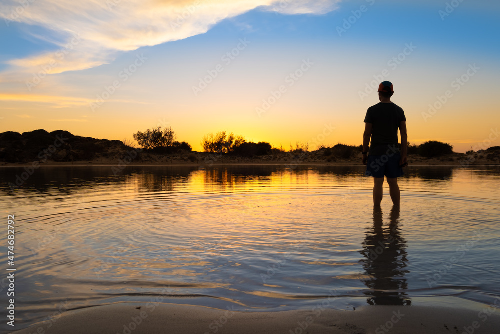Fototapeta premium Stunning sunset over the shallow waters of the Elafonisi lagoon (deer island) on the southwest tip of Crete, Chania region, Greece.