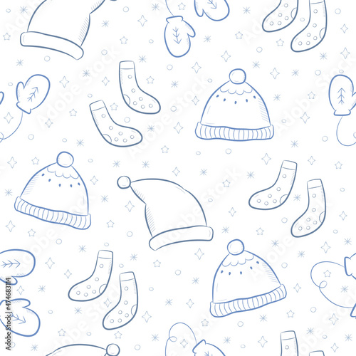 Seamless pattern with winter accessories. Blue background with cute hats, mittens and socks. Vector illustration