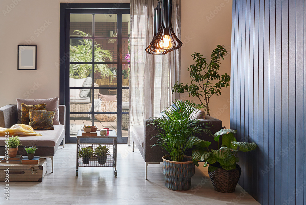 Modern decorative room with sofa and parquet floor, home design, wooden wall background and lamp concept, garden view. Modern decorative room with sofa and parquet floor, home design, wooden wall background and lamp concept, garden view.