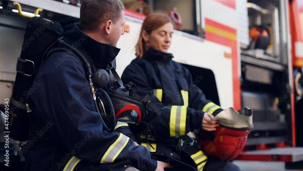 A team of firemen at the form of a fire machine A team of firemen at the form of a fire machine