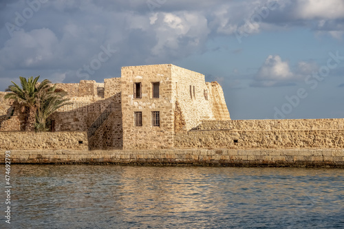 The old Venetian harbor of Chania, Crete, Greece. One of the oldest lighthouses in the world