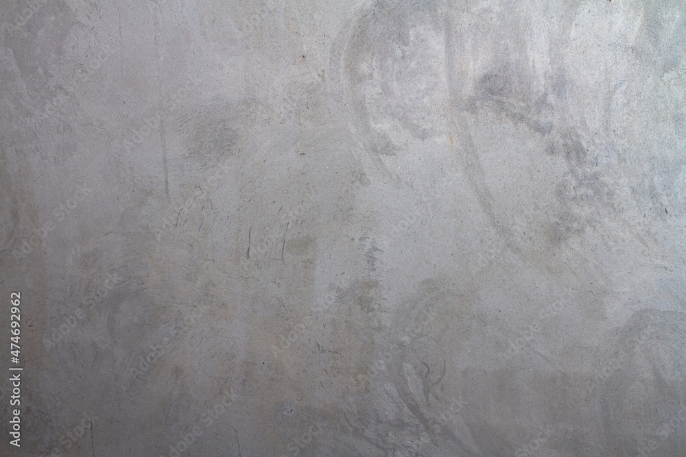 Naklejka premium Grey plastered wall covered with rough textured plaster. Background. copy space