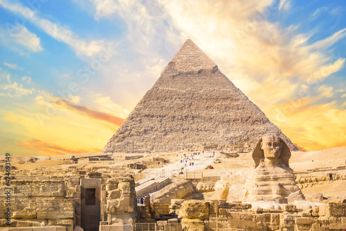 Great Sphinx against the background of the pyramids of the pharaohs Cheops  Khafren  and Mikerin in Giza  Egypt