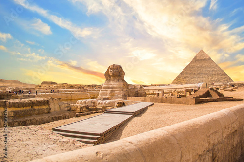 Great Sphinx against the background of the pyramids of the pharaohs Cheops  Khafren  and Mikerin in Giza  Egypt