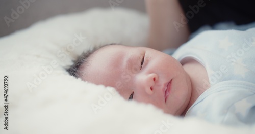 close up portrait face of cute lovely little newborn baby infant sleeping at home, Happiness Newborn Baby at Comfortable Home in Day Lighting Indoors 