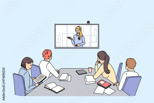 Business coaching and online Discussion concept. Group of young smiling colleagues women and men sitting backwards in office listening to woman making presentation online vector illustration 
