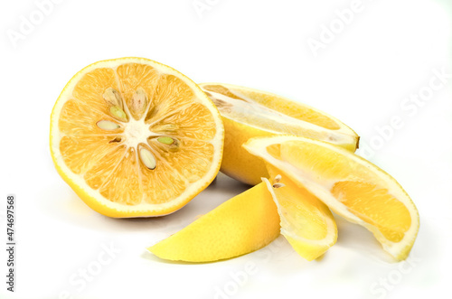 Fresh organic lemons with leaf over white background