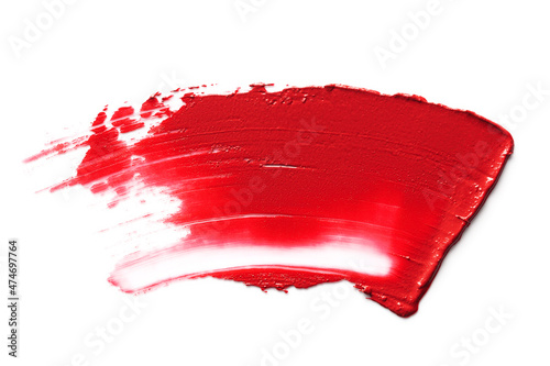 Red smudged lipstick isolated on white background.