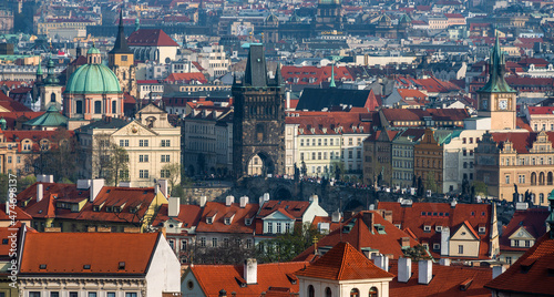 Scenic view of the old district of the Czech capital Prague with many red roofs, churches and towers