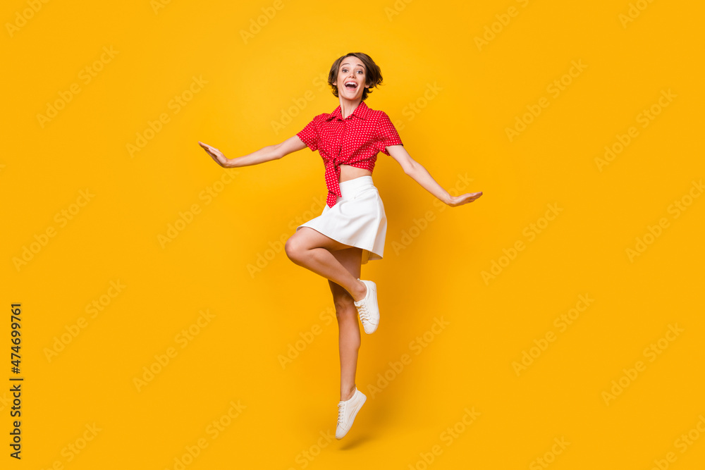 Full size photo of excited cheerful lady have fun good mood look camera isolated on yellow color background
