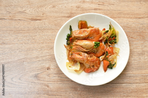 spicy stir fried river shrimp with fresh pepper and finger root on plate