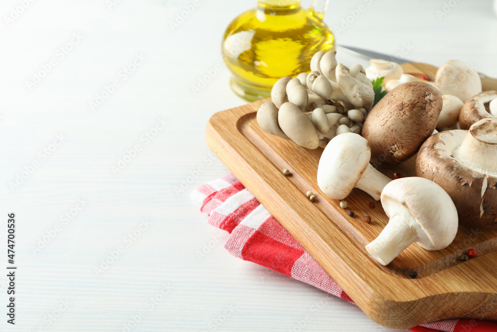 Concept of cooking with mushroom on white wooden Concept of cooking with mushroom on white wooden