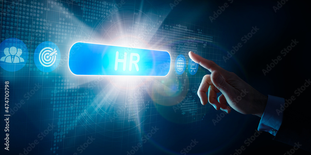 A businessmans hand selecting a HR business word concept on a computer display. A businessmans hand selecting a HR business word concept on a computer display.