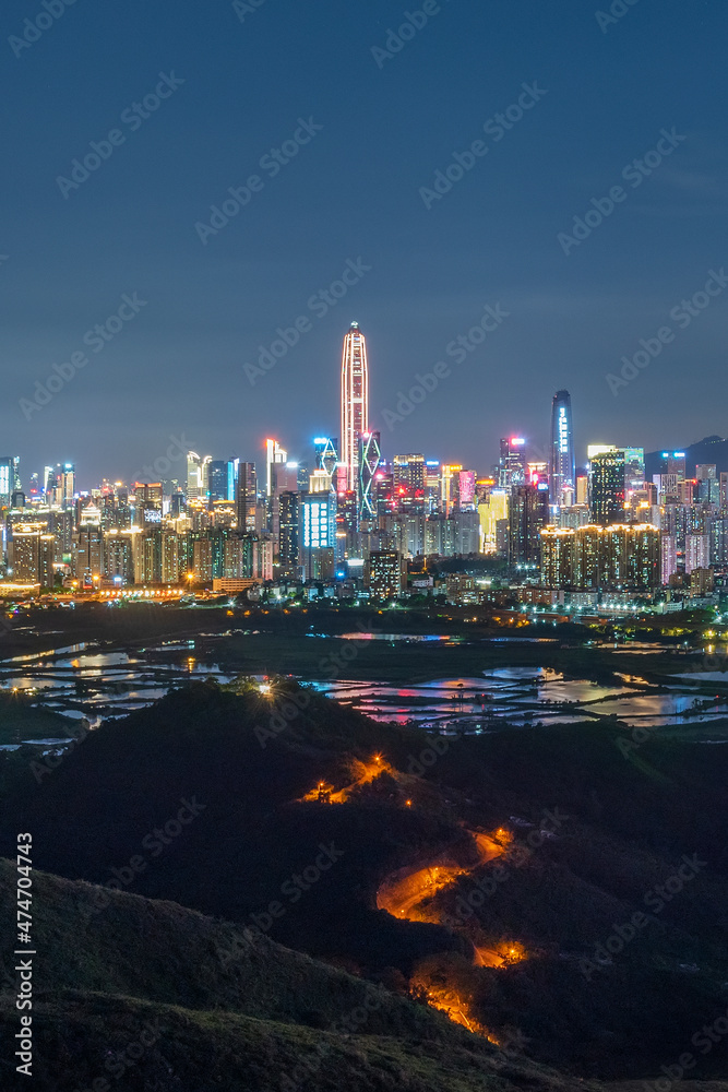 Fototapeta premium Night scenery of panorama of skyline of Shenzhen city, China. Viewed from Hong Kong border