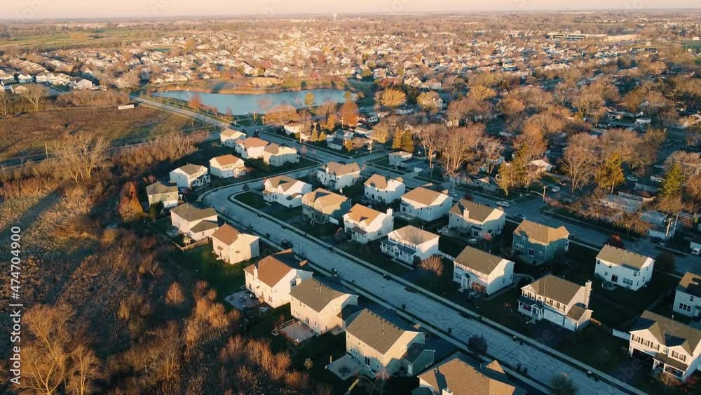 Flight over Mandela - a village in the United States, in Lake County, Illinois. The morning sun illuminates the houses. A small village near Chicago.