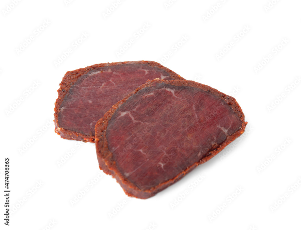 Delicious dry-cured beef basturma slices on white background Delicious dry-cured beef basturma slices on white background
