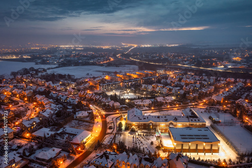 Aerial landscape of small village at dusk covered with fresh snow © Patryk Kosmider