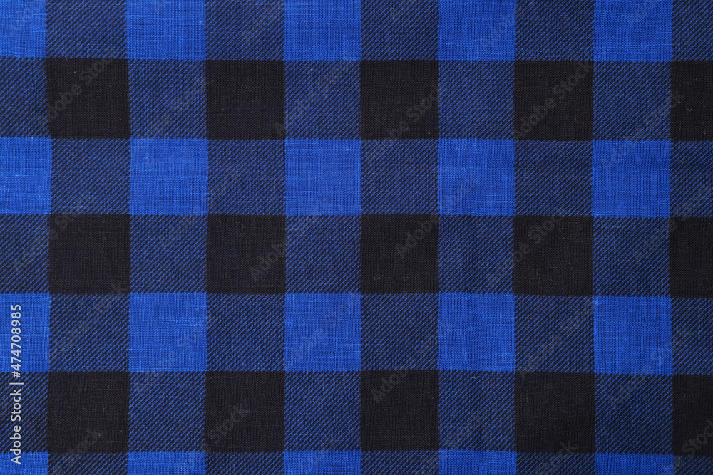 Top view of blue bandana with check pattern as background Top view of blue bandana with check pattern as background