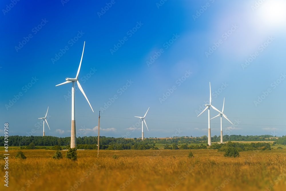 Wind turbines in the field. Eco-energy concept. Wind turbines in the field. Eco-energy concept.