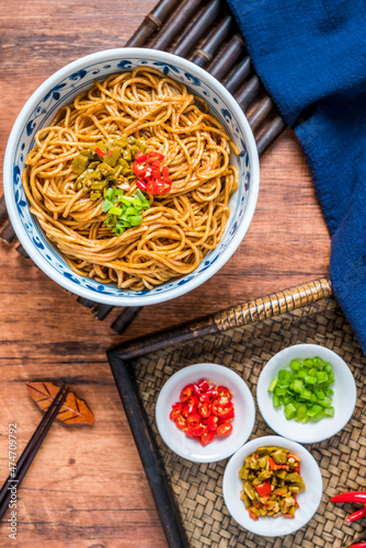 Wuhan gourmet hot dry noodles placed on wooden table  photo