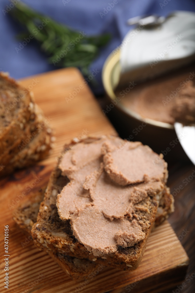 Fresh bread with delicious meat pate on wooden table, closeup