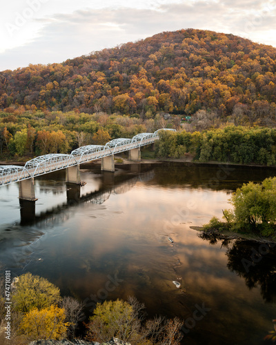 Point of Rocks Bridge spans the gorgeous Potomac River across from the state of Maryland to the state of Virginia on a sunny Autumn afternoon.