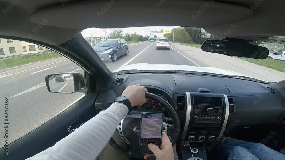 driving car and texting message on the phone