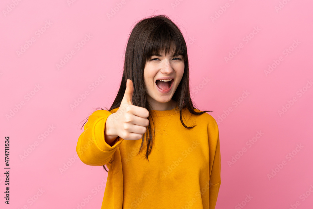 Young Ukrainian woman isolated on pink background with thumbs up because something good has happened Young Ukrainian woman isolated on pink background with thumbs up because something good has happened