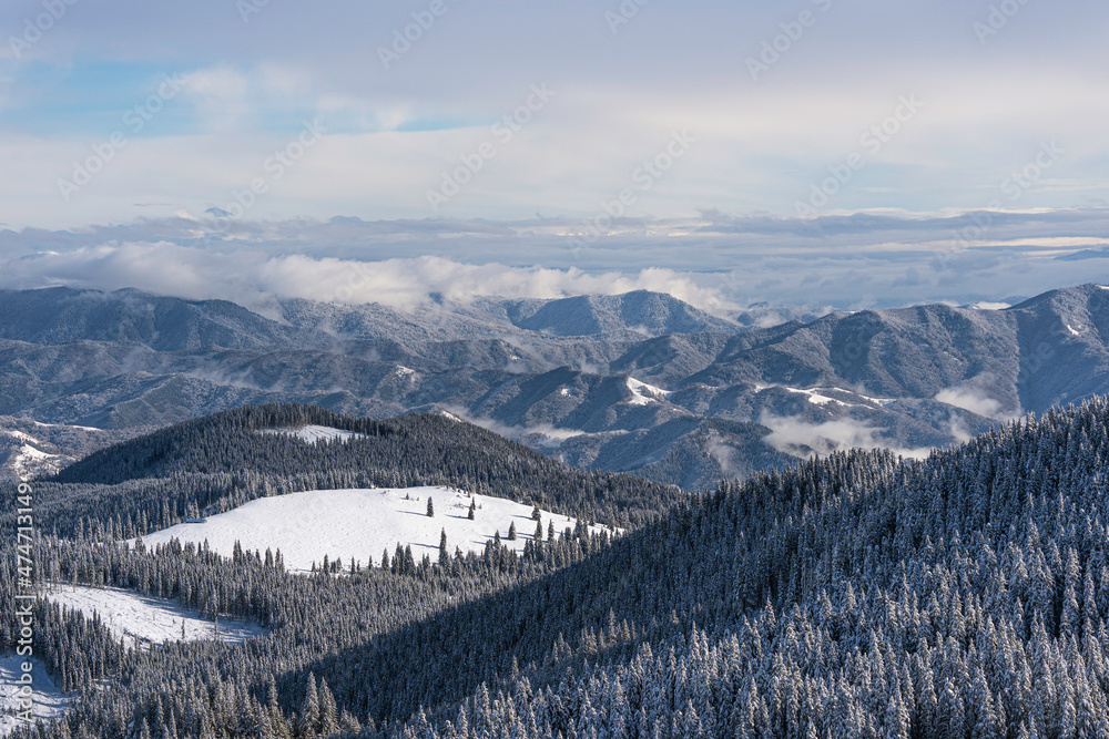 snow covered mountain peaks ( Latorita Mountains, Romania, December 2021)