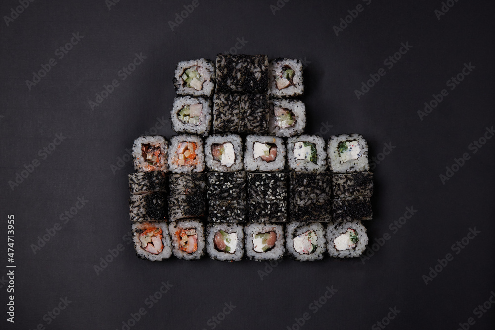 a portion of different rolls on the table, japanese food, sushi set on marble, top view, chinese chopsticks a portion of different rolls on the table, japanese food, sushi set on marble, top view, chinese chopsticks