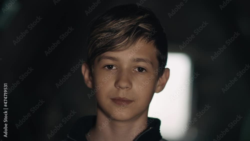 cinematic portrait of a teen boy looking at the camera, indoors, , neutral emotion, poker face cinematic portrait of a teen boy looking at the camera, indoors, , neutral emotion, poker face