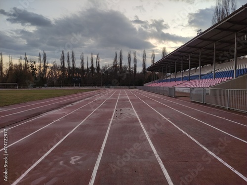 Running tracks in the stadium in evening in winter