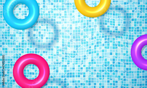 Realistic swimming pool summer background with multicolored floating rubber rings vector