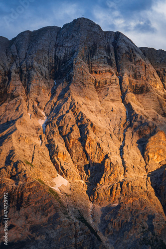 The mountain group "sas dla crusc", within the Unesco heritage area of the Dolomites, with the lights of the sunset, near the town of "la Villa", Italy - August 2